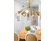 Dining area with designer chandelier and dining table with seating for six at 89 Oneida St, Denver, CO 80230