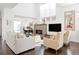 Comfortable living room featuring a fireplace, hardwood floors, and a cozy seating area at 89 Oneida St, Denver, CO 80230