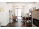 Stylish office space boasts hardwood flooring, modern lighting, and glass door entry at 89 Oneida St, Denver, CO 80230