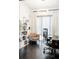 Home office features hardwood floors, modern lighting, a large window, and a glass door entry at 89 Oneida St, Denver, CO 80230