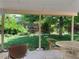 Inviting outdoor seating area with green lawn views and shady trees at 11600 E Adriatic Pl, Aurora, CO 80014
