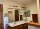 Well-lit bathroom featuring a double sink vanity with a large mirror and updated fixtures at 11600 E Adriatic Pl, Aurora, CO 80014