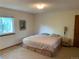 Cozy bedroom with a large window, neutral carpeting, and space for comfortable living at 11600 E Adriatic Pl, Aurora, CO 80014