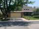 Traditional two-story home featuring an attached two-car garage and well-maintained landscaping at 11600 E Adriatic Pl, Aurora, CO 80014