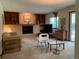 The living room has built-in shelving, a fireplace, and sliding glass doors to the back patio at 11600 E Adriatic Pl, Aurora, CO 80014