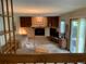 A view from the landing, the living room has built-in shelving, a fireplace, and doors to the back patio at 11600 E Adriatic Pl, Aurora, CO 80014