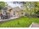 Well maintained backyard with outdoor seating and manicured lawn at 16200 Hedgeway Dr, Parker, CO 80134