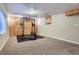 Basement gym with functional workout equipment and wood paneled accents at 16200 Hedgeway Dr, Parker, CO 80134