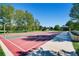 Outdoor community basketball court with green accents and nearby shelter at 16200 Hedgeway Dr, Parker, CO 80134