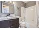 This renovated bathroom features an updated vanity, tub, and a horse picture on the wall at 16200 Hedgeway Dr, Parker, CO 80134