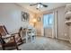 Inviting bedroom with natural light and an adjacent craft area, complete with a sewing machine at 16200 Hedgeway Dr, Parker, CO 80134
