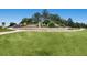 Well-maintained Stonegate community entrance with colorful landscaping and signage at 16200 Hedgeway Dr, Parker, CO 80134