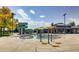 Community pool and splashpad with a playground, waterslides, and clubhouse in the background at 16200 Hedgeway Dr, Parker, CO 80134