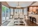 Bright dining area with a window view, perfect for indoor-outdoor dining and entertaining guests at 16200 Hedgeway Dr, Parker, CO 80134