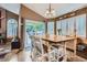 Charming dining area with large sliding doors, perfect for indoor-outdoor dining and entertaining guests at 16200 Hedgeway Dr, Parker, CO 80134