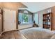 Welcoming entryway with large window seat, hardwood floors, and ample natural light, leading to a cozy interior at 16200 Hedgeway Dr, Parker, CO 80134