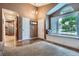 Welcoming entryway featuring hardwood floors, a cozy window seat, and ample natural light at 16200 Hedgeway Dr, Parker, CO 80134