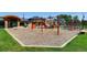Community playground with swings, slides, climbing structures, and ample seating at 16200 Hedgeway Dr, Parker, CO 80134