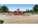 Community playground with slides, climbing structures, and ample seating at 16200 Hedgeway Dr, Parker, CO 80134