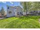 Large backyard with a patio and privacy screens perfect for relaxing and entertaining guests at 1153 Berganot Trl, Castle Pines, CO 80108