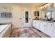 Spacious bathroom features double sinks with granite counters, tile floors, and a separate tub and shower at 1153 Berganot Trl, Castle Pines, CO 80108