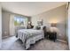 Comfortable bedroom with neutral colors, soft carpeting, and natural light creates a cozy and inviting space at 1153 Berganot Trl, Castle Pines, CO 80108