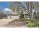 Charming two-story home featuring a large front yard, attached two-car garage, and welcoming front porch at 1153 Berganot Trl, Castle Pines, CO 80108
