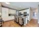 Well-appointed kitchen featuring a large island, granite countertops, stainless steel appliances, and ample cabinet space at 1153 Berganot Trl, Castle Pines, CO 80108