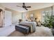 Spacious primary bedroom boasts natural light, plush carpeting, and tasteful decor, perfect for rest and relaxation at 1153 Berganot Trl, Castle Pines, CO 80108