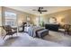 Serene primary bedroom with large windows, a comfortable bed, and stylish furnishings for a peaceful and relaxing retreat at 1153 Berganot Trl, Castle Pines, CO 80108