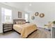 Bright bedroom with two large windows, contemporary decor, and wood-look flooring at 4692 Hatcher Dr, Brighton, CO 80601