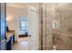 Modern bathroom with glass shower and granite countertops at 5455 Landmark Pl # 1103, Greenwood Village, CO 80111