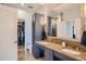 Elegant bathroom featuring a double vanity and tiled walk-in shower at 5455 Landmark Pl # 1103, Greenwood Village, CO 80111
