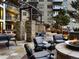 Outdoor courtyard seating area with patio stone and garden beds at 5455 Landmark Pl # 1103, Greenwood Village, CO 80111