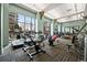 A bright fitness center with modern equipment, large windows, and plenty of workout space at 5455 Landmark Pl # 1103, Greenwood Village, CO 80111