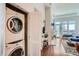 Convenient laundry room setup with washer and dryer inside a spacious residence at 5455 Landmark Pl # 1103, Greenwood Village, CO 80111