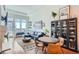 Bright living room with hardwood floors, large windows, and modern furniture at 5455 Landmark Pl # 1103, Greenwood Village, CO 80111