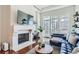 Comfortable living room featuring a fireplace, tv, and stylish decor at 5455 Landmark Pl # 1103, Greenwood Village, CO 80111