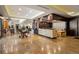 An inviting lobby area with a marble reception desk, elegant decor, and comfortable seating at 5455 Landmark Pl # 1103, Greenwood Village, CO 80111