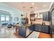 Open layout showcases kitchen with stainless appliances flowing into bright living space at 5455 Landmark Pl # 1103, Greenwood Village, CO 80111