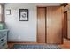 Bedroom with gray walls, wood floors, and a large closet provides a cozy space for relaxation at 4833 S Elati St, Englewood, CO 80110