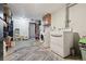 Basement laundry area with modern washer, dryer, and storage shelves offers convenience and organization at 4833 S Elati St, Englewood, CO 80110