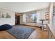 Bright living room featuring hardwood floors, a large window with natural light, and stylish accents at 4833 S Elati St, Englewood, CO 80110