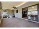 Inviting sunroom with a fireplace, ceiling fan, and sliding glass doors, perfect for relaxation and gatherings at 4833 S Elati St, Englewood, CO 80110