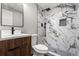Updated bathroom with elegant marble tile shower and modern vanity at 1182 Clermont St # 201, Denver, CO 80220