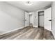 A bright bedroom with modern flooring and neutral wall colors at 1182 Clermont St # 201, Denver, CO 80220
