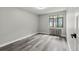 Cozy bedroom with modern flooring, a radiator, and bright window at 1182 Clermont St # 201, Denver, CO 80220