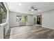 Bright living room featuring updated flooring, large windows and natural light at 1182 Clermont St # 201, Denver, CO 80220