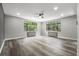 Bright living room with large windows and modern ceiling fan for comfortable, stylish living at 1182 Clermont St # 201, Denver, CO 80220