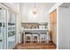 Inviting breakfast bar featuring counter seating, with natural lighting from sliding glass door at 13097 S Bonney St, Parker, CO 80134